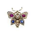 Image 1 of Gold butterfly brooch with diamond, ruby, and sapphire; approx. 1.20 ct.