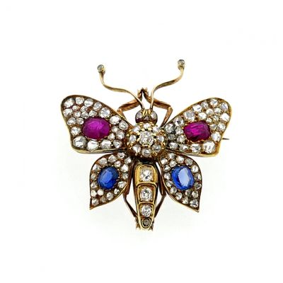 Gold butterfly brooch with diamond, ruby, and sapphire; approx. 1.20 ct. Image 1 of Gold butterfly brooch with diamond, ruby, and sapphire; approx. 1.20 ct.