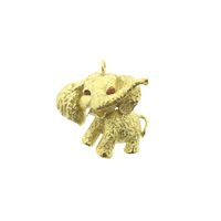 Gold pendant of an elephant with carnelian
