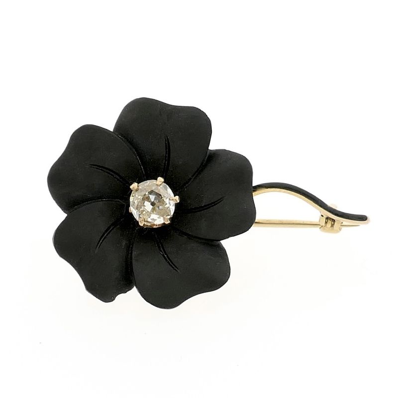 Image 1 of Gold flower brooch with onyx and diamond | 0.60 ct.