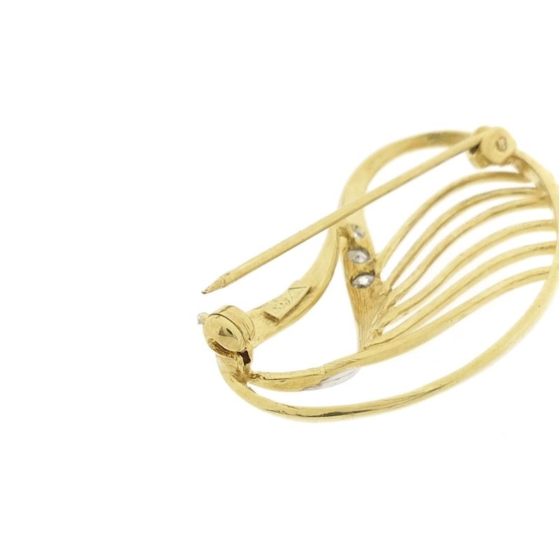 Image 9 of Two-tone gold brooch with zirconia.