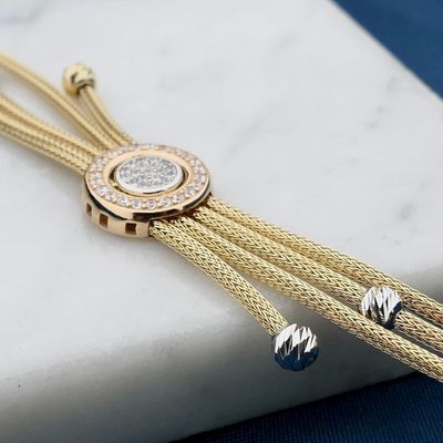 Afbeelding 2 van Tricolor gouden schakelarmband met zirconia