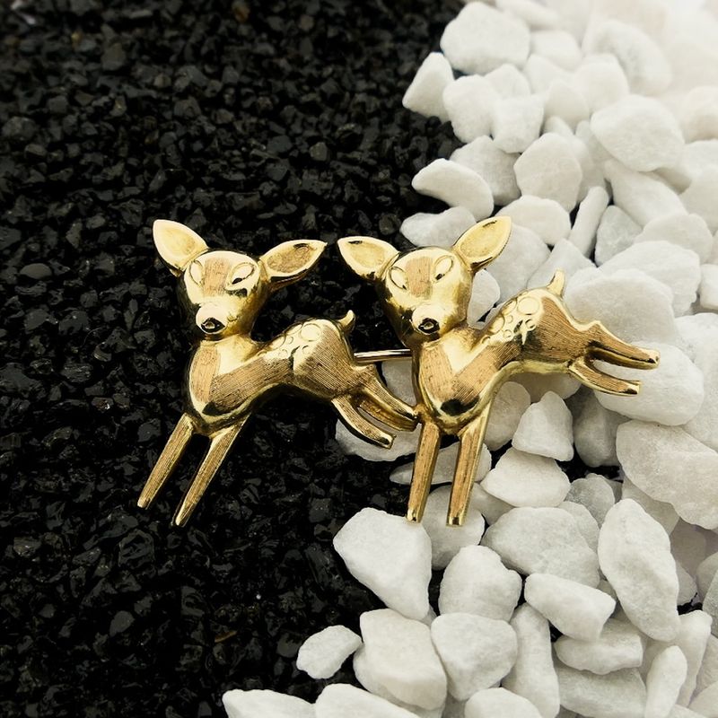 Image 2 of Golden brooch with deer.