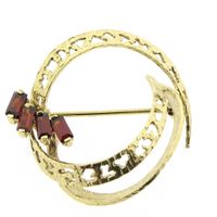 Vintage gold round fantasy brooch with red stones