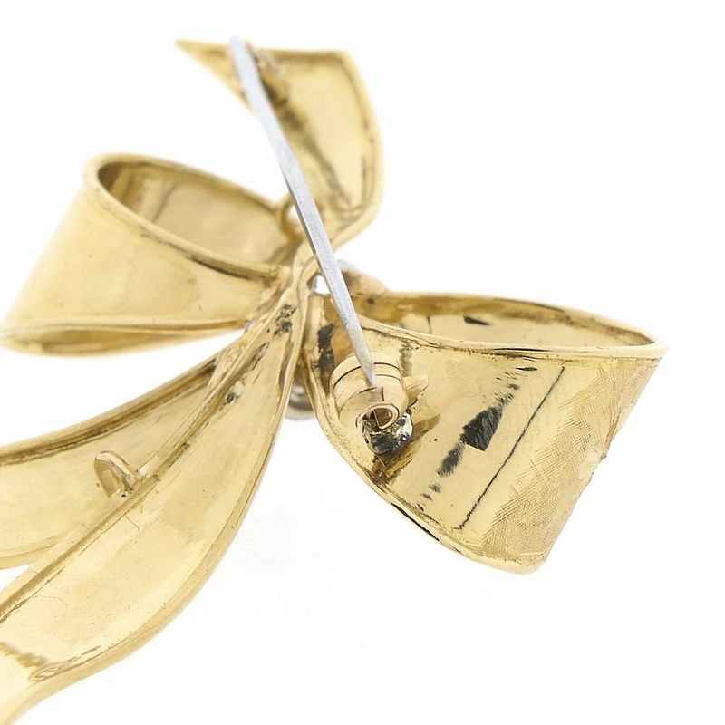 Image 5 of Gold brooch in the form of a bow with diamonds; 0.035 ct.