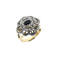 Gold entourage ring with sapphire and diamonds; approx. 0.51 ct.