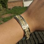 Image 3 of Gold wide slave bracelet with engravings; Size M