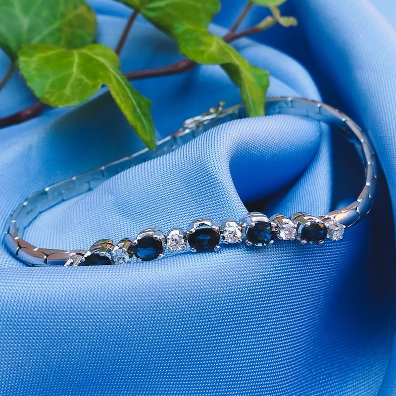 Image 10 of White gold cobra link bracelet with sapphire and diamond; 0.24 ct.
