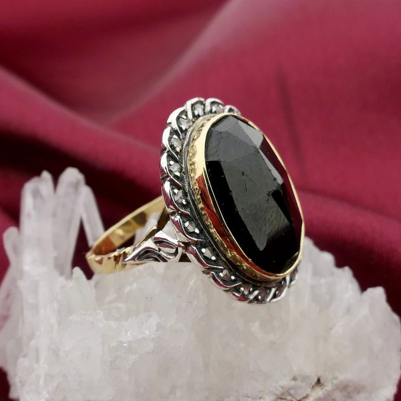 Image 2 of Gold and silver ring with garnet and diamonds; Approx. 0.20 ct.