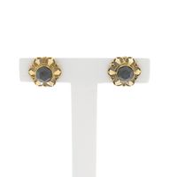Gold floral stud earrings with garnet