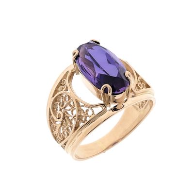 Image 1 of Vintage rose gold ring set with a synthetic purple gemstone.