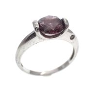 Silver solitaire ring with dark pink zirconia