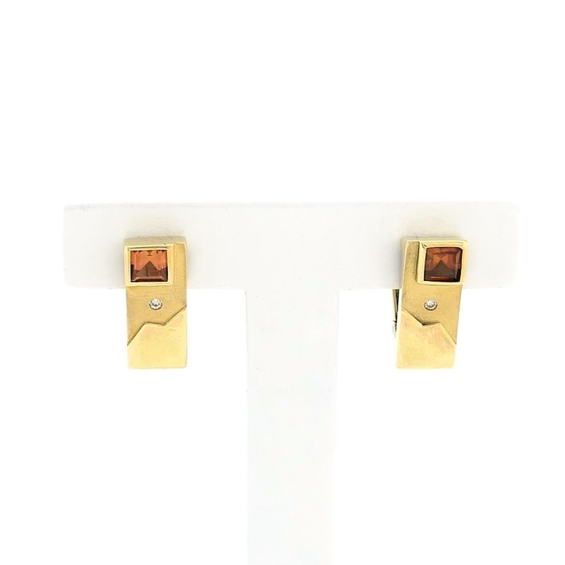Image 1 of Gold stud earrings with synthetic orange sapphire and zirconia