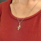 Image 4 of Gold pendant of a monkey with banana