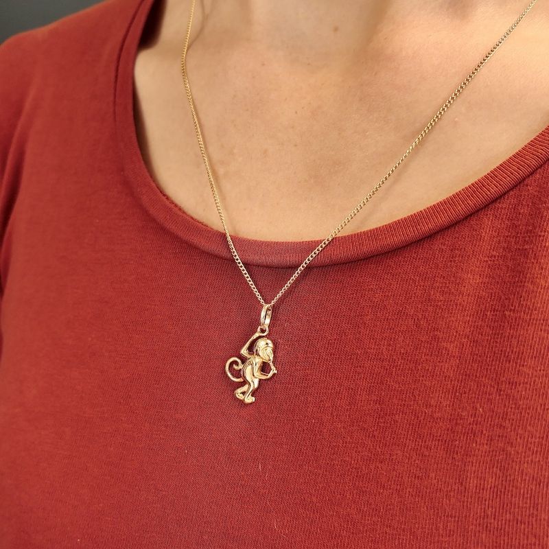Image 4 of Gold pendant of a monkey with banana