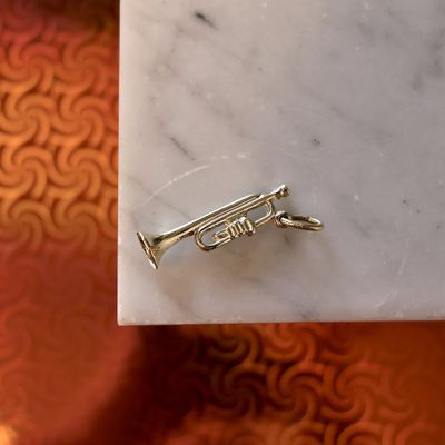 Image 2 of Gold pendant of a trumpet