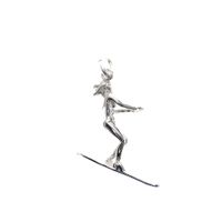 Silver charm of a water skier