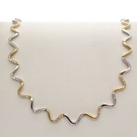 Gold winding necklace set with zirconia