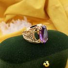 Image 2 of Vintage rose gold ring set with a synthetic purple gemstone.