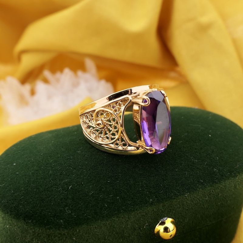 Image 2 of Vintage rose gold ring set with a synthetic purple gemstone.