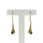 Image 1 of Vintage gold earrings with dark red stone