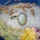 Image 2 of 18-karat white gold ring with opal and entourage of diamonds | 0.60 ct.