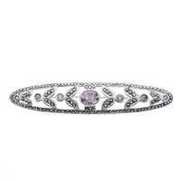 Silver brooch with purple zirconia stones
