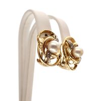 Vintage gold clip-on earrings with pearl and diamonds; 0.08 ct.