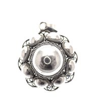Silver pendant of a large Zeeland button