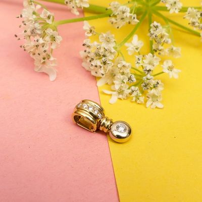 Image 2 of Two-tone gold pendant with diamond | 0.075 ct.