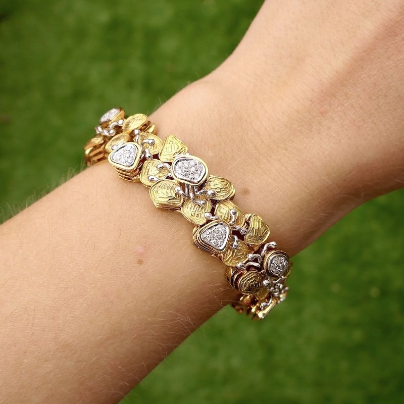 Image 11 of Two-tone gold fantasy bracelet with 0.525 ct diamond.