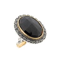 Gold and silver ring with garnet and diamonds; Approx. 0.20 ct.