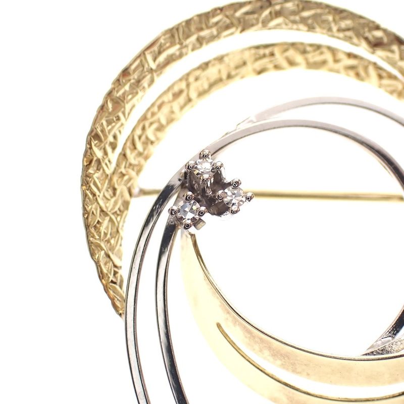 Image 3 of Two-tone gold brooch with 0.06 ct diamond.