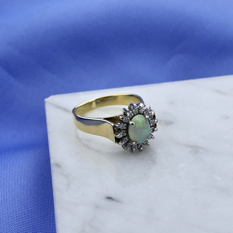 Image 8 of Gold ring with opal and entourage of diamonds; 0.16 ct.