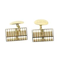 Gold cufflinks as an abacus.