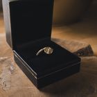 Image 2 of Two-tone gold solitaire ring with 0.05 ct diamond.