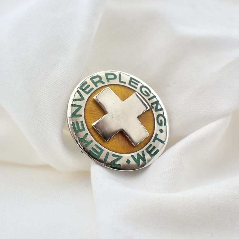 Image 4 of Silver brooch of a nursing A-badge