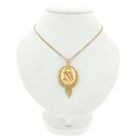 Image 3 of gold pendant of a hat bell