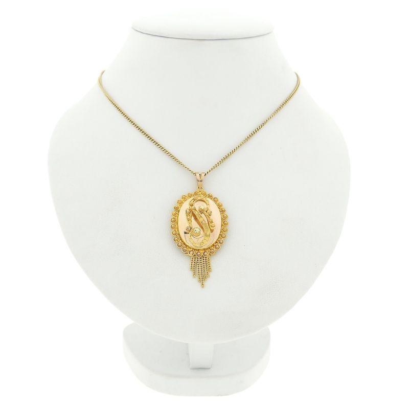 Image 3 of gold pendant of a hat bell