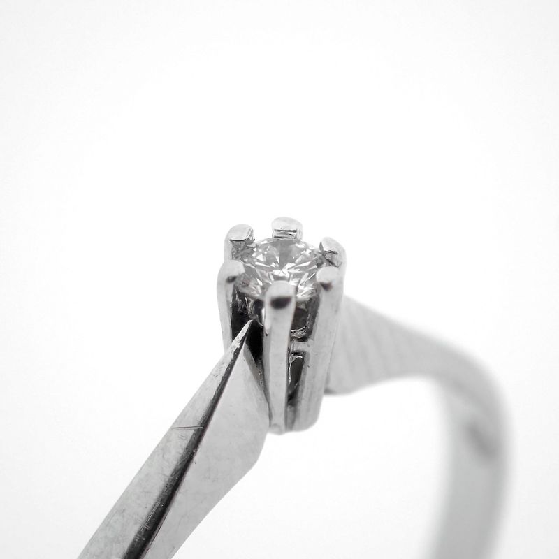 Image 3 of White gold solitaire ring with 0.04 ct diamond.