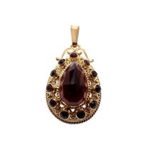 Vintage gold pendant with garnet stones