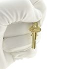 Image 9 of 18 carat gold pendant of a key