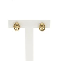 Gold stud earrings as a button
