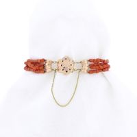 Antique red coral beaded bracelet with bicolor gold clasp.