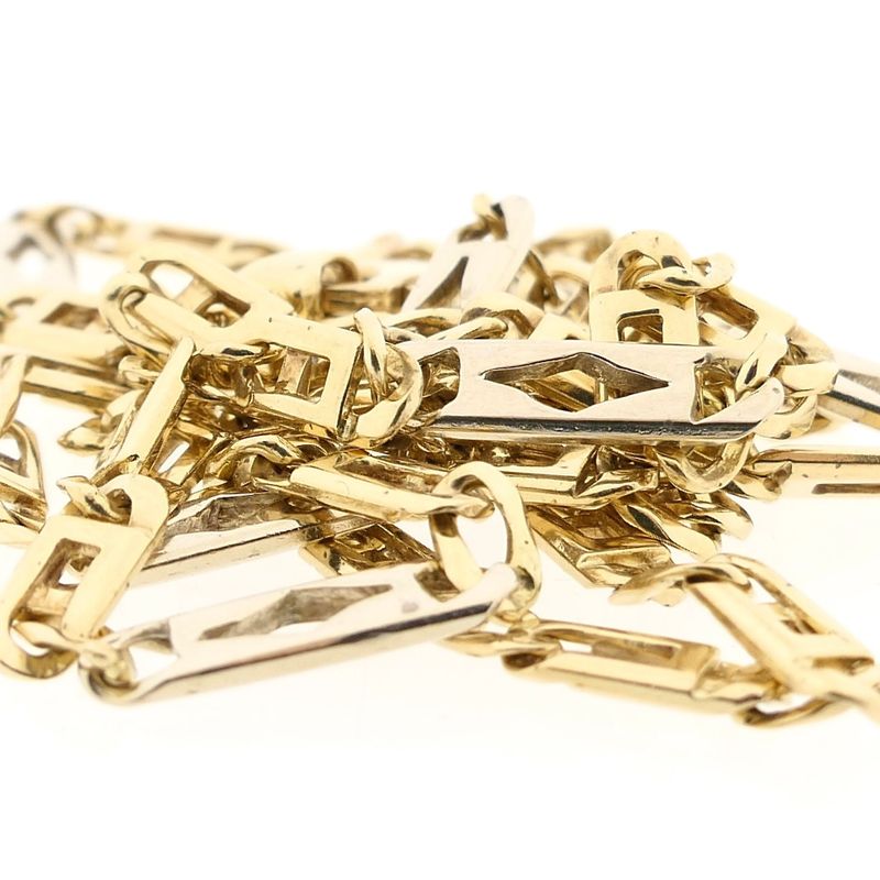 Afbeelding 7 van Gouden valkenoog schakelketting met witgouden wiebertjes