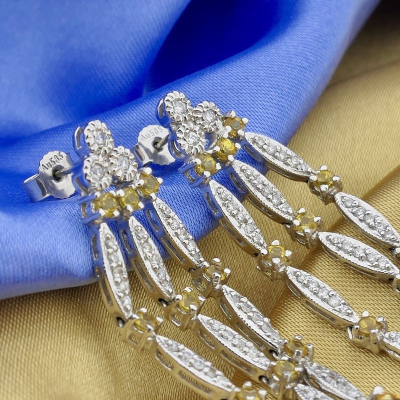 Image 8 of White gold stud earrings with yellow sapphire and diamond; 0.56 ct.