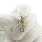 Image 8 of Two-tone gold bow pendant with diamond | 0.04 ct.