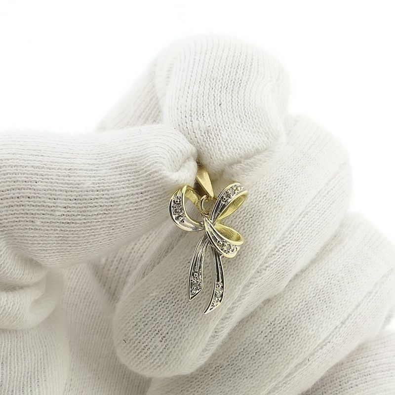 Image 8 of Two-tone gold bow pendant with diamond | 0.04 ct.