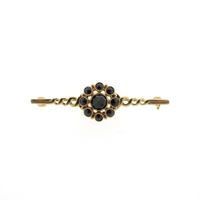 Antique gold brooch with garnet