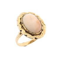 Gold ring set with angel skin coral
